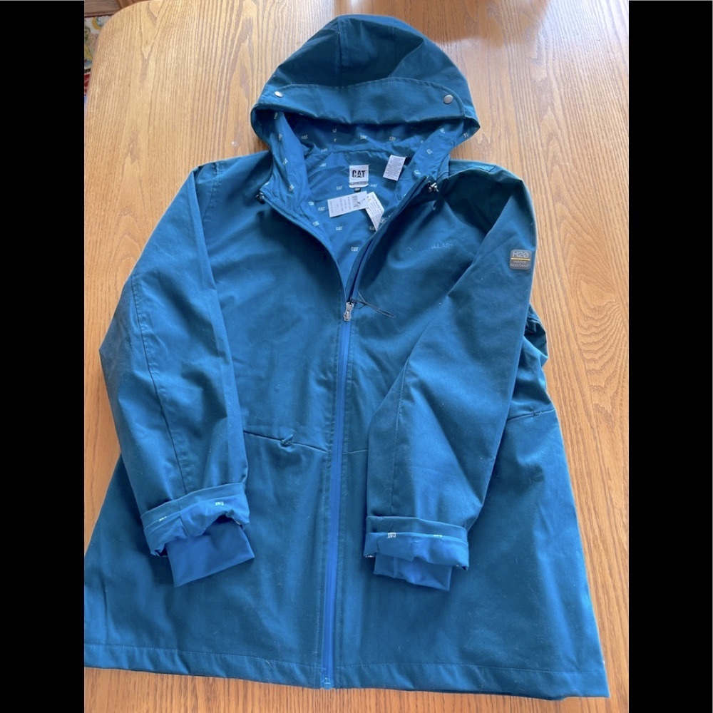 CAT ( Caterpillar ) Women’s winter hooded coat. Teal color, thumb hole as seen
